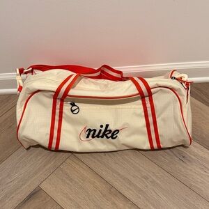 Nike Cream Duffel Bag with Red Stripes